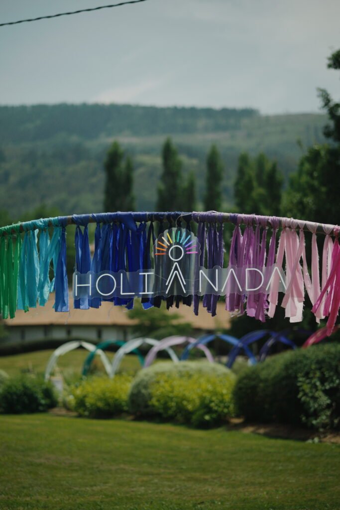 Holi Nada sign in a garden.