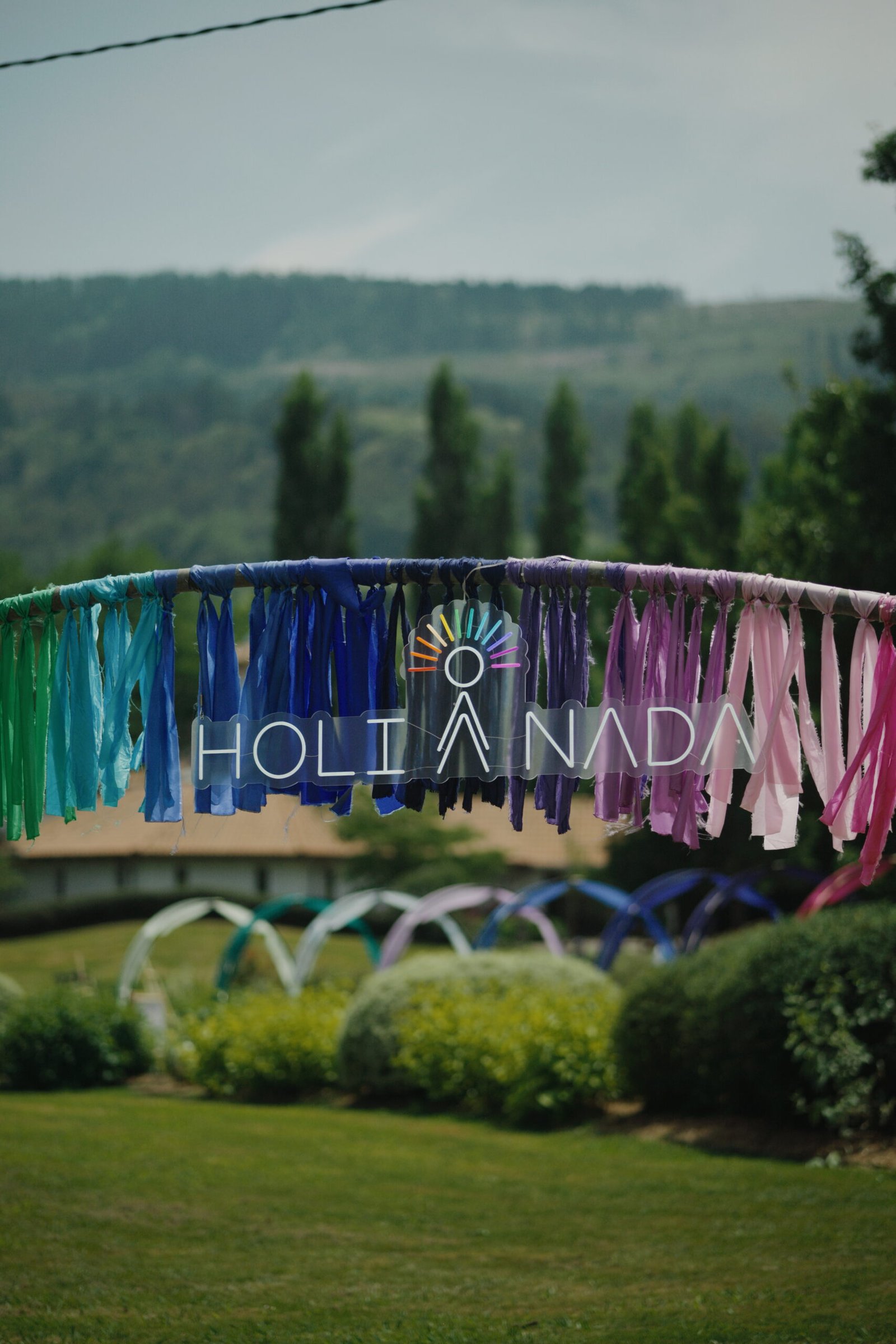 Holi Nada sign in a garden.